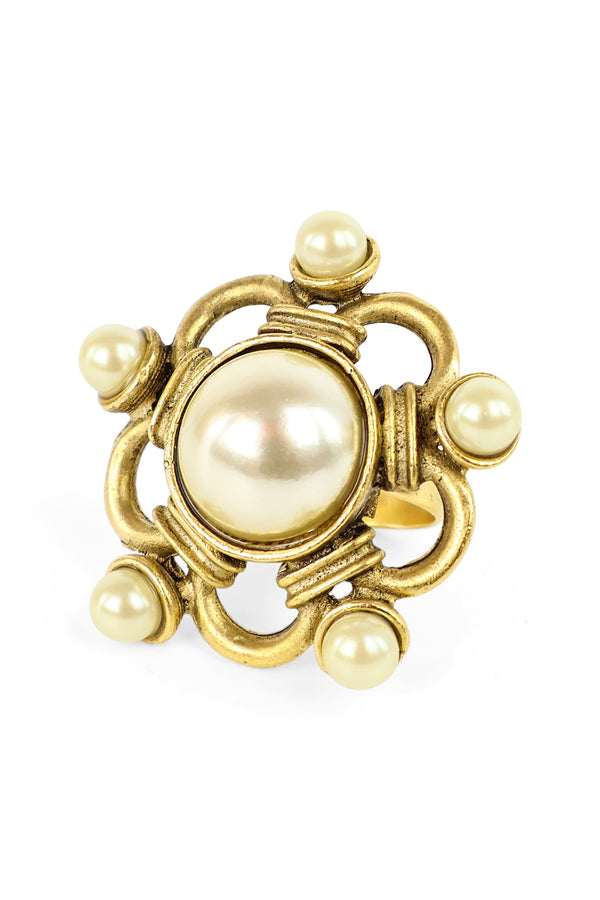 Hand crafted in New York, the Yochi Big Pearl Ring features 22k gold plated brass with a large italian pearl at its center.