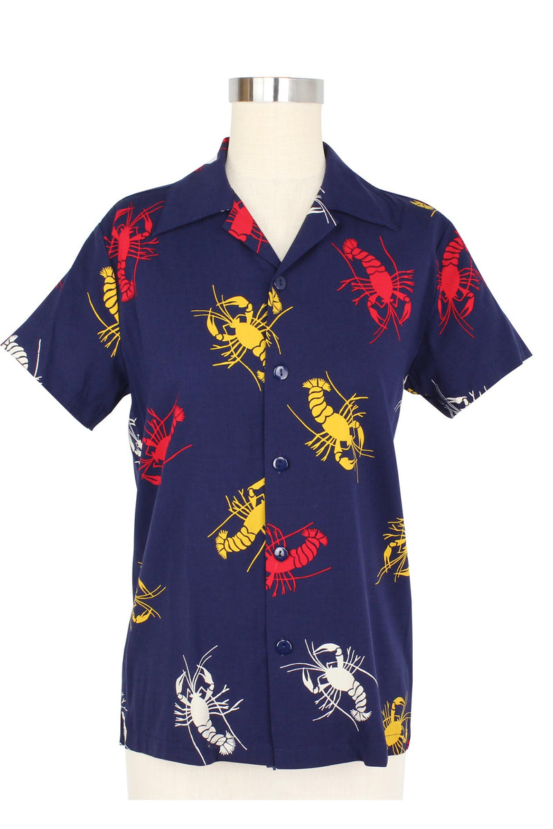The Freddy Shirt is a 1940s vintage reproduction men's shirt featuring a button up front and short sleeves. Sized in traditional menswear sizing, the Freddy Shirt is easy to wear for most, perfect for a matchy-matchy outfit at Tiki Oasis, or out and about worn over the high waist shorts or romper.