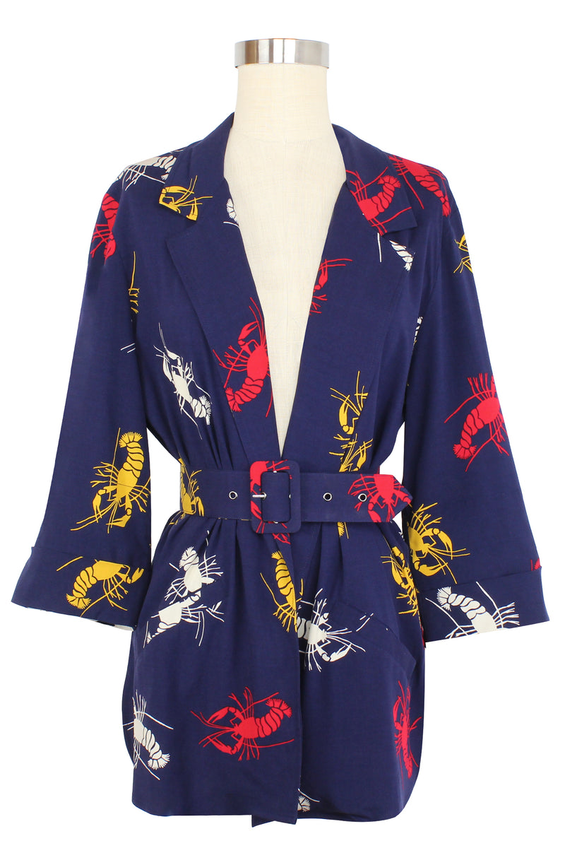 The 1980's / 90's inspired Heather Blazer is a perfect piece to wear open, crossed over, or cinched closed as a blouse with its matching removable belt. Great details on this style include-patch pockets on the front, sleeves lined to be cuffed to your liking, and in a slightly oversized relaxed fit in the new Crawfish print, a 1930s/40s novelty print of red, yellow, and white crustaceans on a deep navy blue background as a nod to Schiaparelli's lobster.