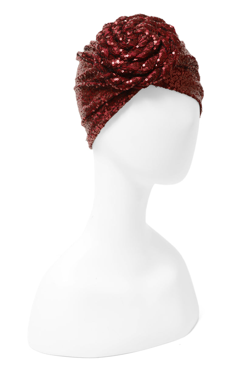 Great with caftans, the Yves Dress, and more! Finish your look with a sequin embellished stretch turban featuring a premade statement rosette for easy glamour-to-go.  One of many hues, this listing is for the deep burgundy sequin rosette turban.