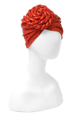 Great with caftans, the Yves Dress, and more! Finish your look with a sequin embellished stretch turban featuring a premade statement rosette for easy glamour-to-go. One of many hues, this listing is for the fiery orange sequin rosette turban.